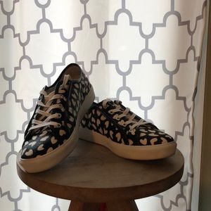 Ann Taylor black sneaker with white hearts.  Worn once.